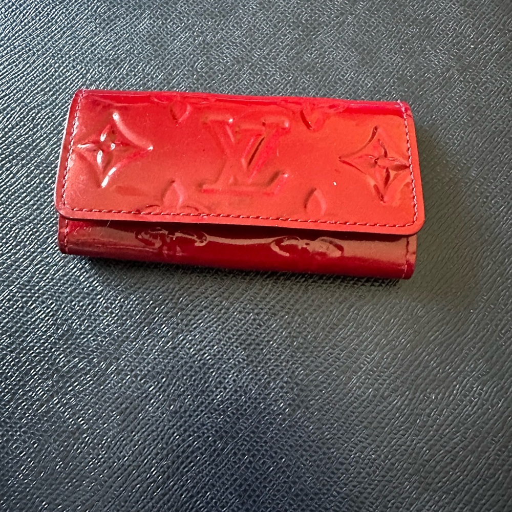 100 percent authentic lv key pouch in good shape.